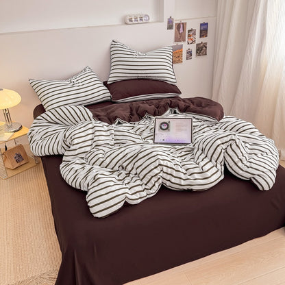 Olive green striped bedding set on white with deep brown solid sheet and reverse