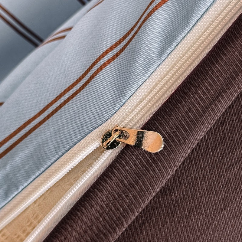 Blue striped bedding set with thin lines on white and a dark brown solid reverse