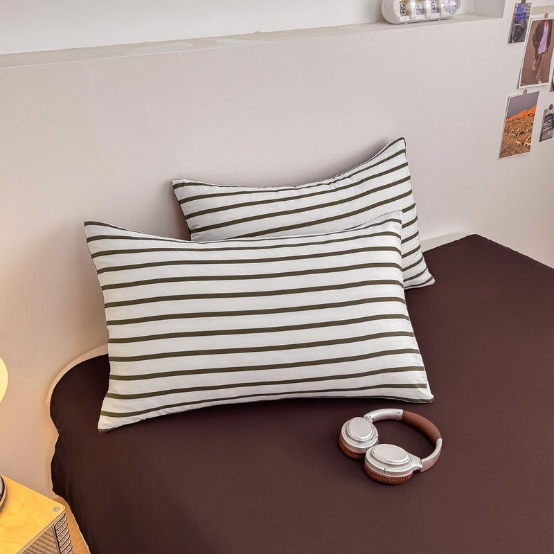 Olive green striped bedding set on white with deep brown solid sheet and reverse