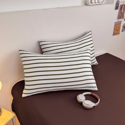 Olive green striped bedding set on white with deep brown solid sheet and reverse