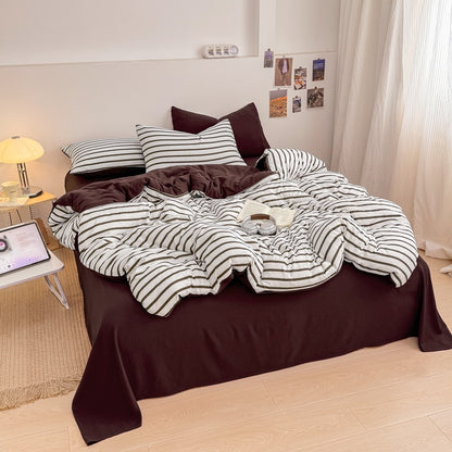 Olive green striped bedding set on white with deep brown solid sheet and reverse