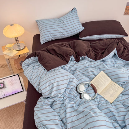 Blue striped bedding set with thin lines on white and a dark brown solid reverse