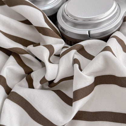 Olive green striped bedding set on white with deep brown solid sheet and reverse