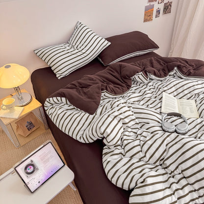 Olive green striped bedding set on white with deep brown solid sheet and reverse