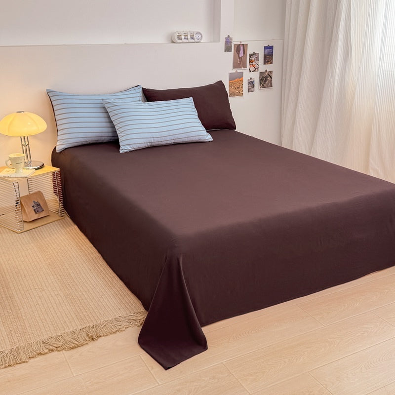 Blue striped bedding set with thin lines on white and a dark brown solid reverse