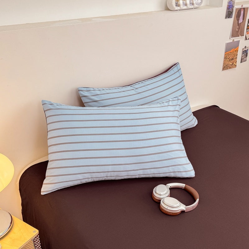 Blue striped bedding set with thin lines on white and a dark brown solid reverse