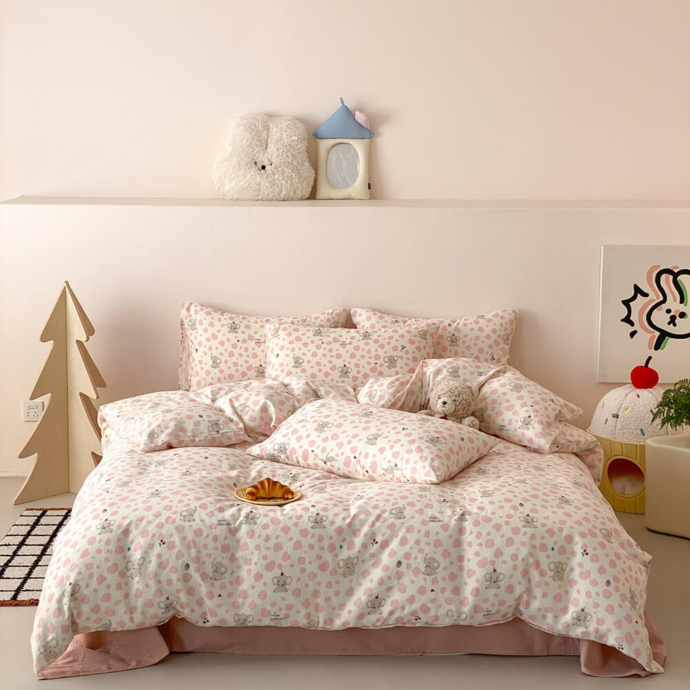 Pippa Elephant Spot Cotton Bedding Set - full bed view in cream and pink spots with blush sheet - WhisperLinens
