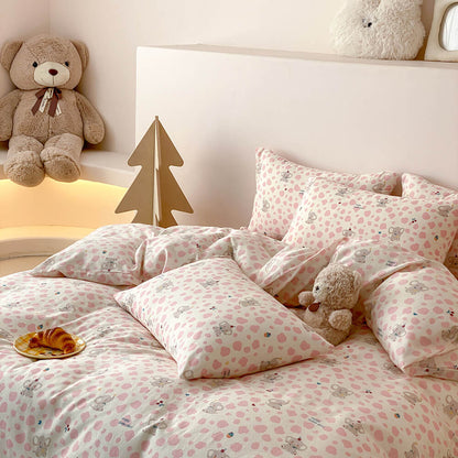 Pippa Elephant Spot Cotton Bedding Set - pink-spotted pillowcases stacked on the bed - WhisperLinens
