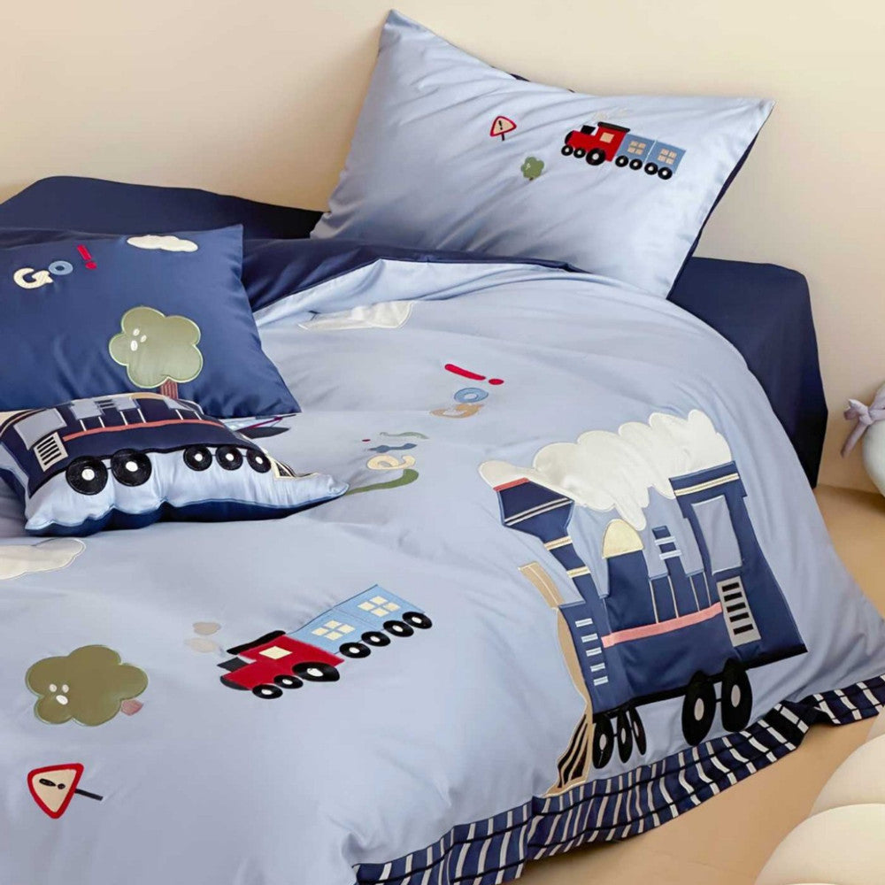 Junction Train Appliqué Cotton Bedding Set - train appliqué and navy reverse on the bed - WhisperLinens