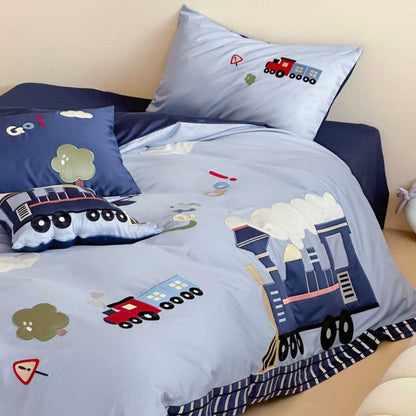 Junction Train Appliqué Cotton Bedding Set - train appliqué and navy reverse on the bed - WhisperLinens