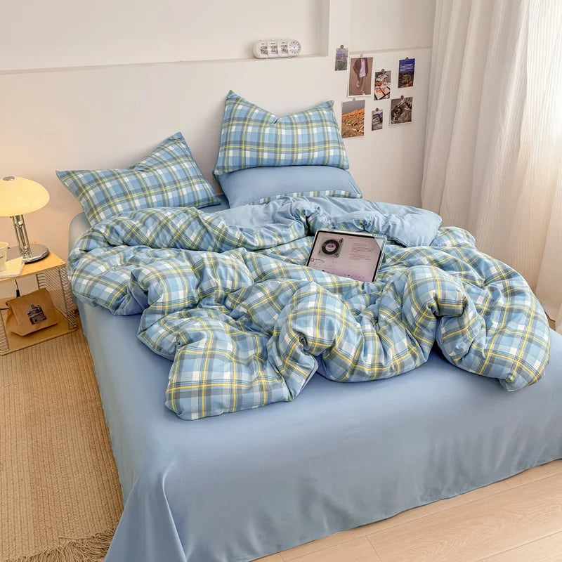Cornflower Yellow plaid bedding set with solid blue reverse styled on a bed