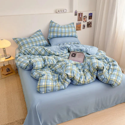 Cornflower Yellow plaid bedding set with solid blue reverse styled on a bed