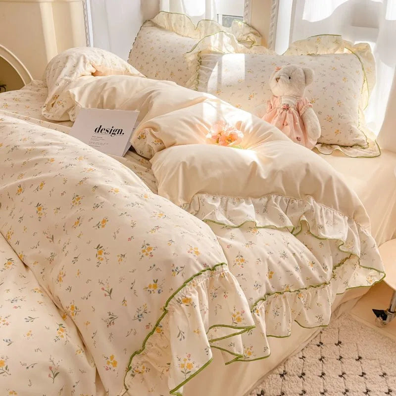 Buttercup Ditsy floral ruffle bedding set with green trim styled on a bed