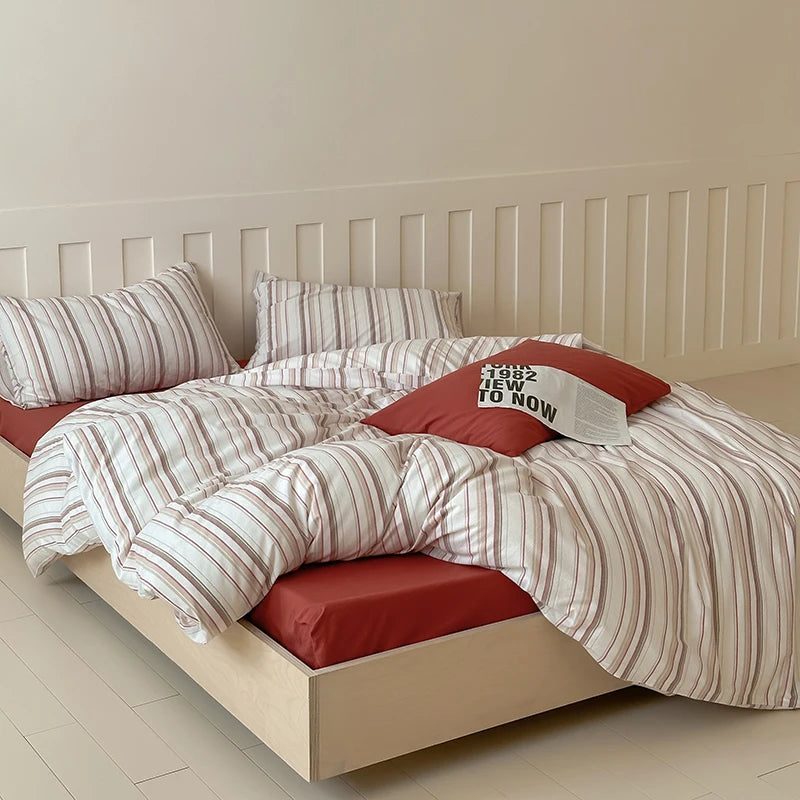 Red pinstripe cotton bedding set with solid red base sheet