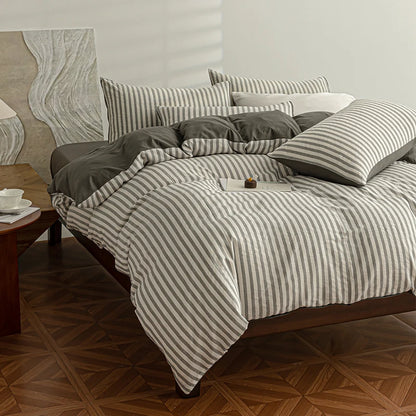 Charcoal Grey seersucker bedding set styled on a bed with matching pillows