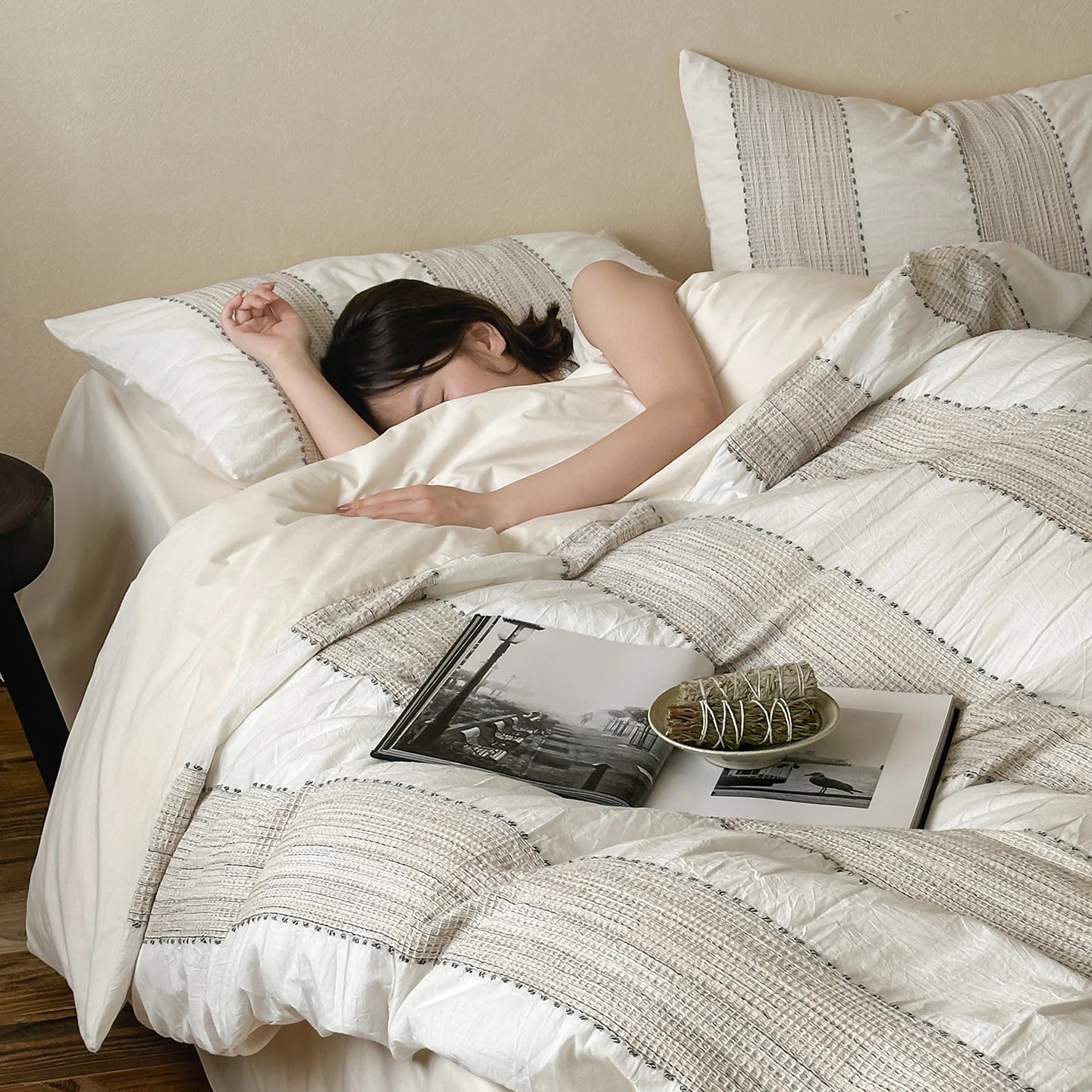 Close-up of textured cotton pillowcase with thin contrast stripe
