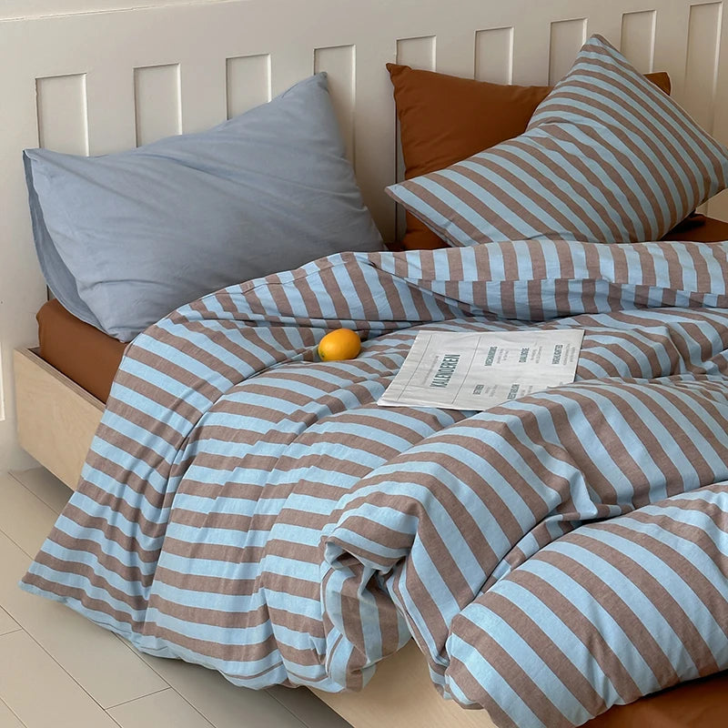 Blue-gray striped cotton bedding set with solid blue-gray pillow