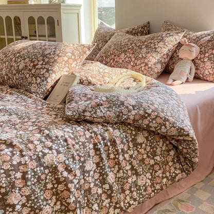 Cocoa Rose vintage floral bedding set in pink roses on brown styled on a bed