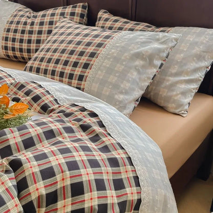 Charcoal Check plaid bedding set with white lace trim styled on a bed