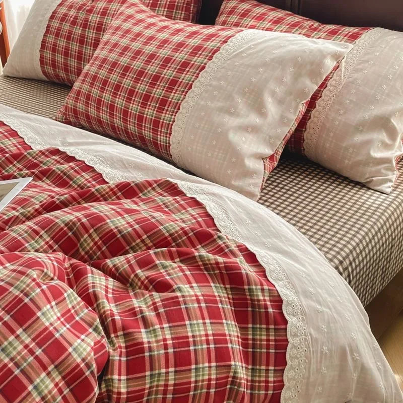 Classic Red Check plaid bedding set with white lace trim styled on a bed