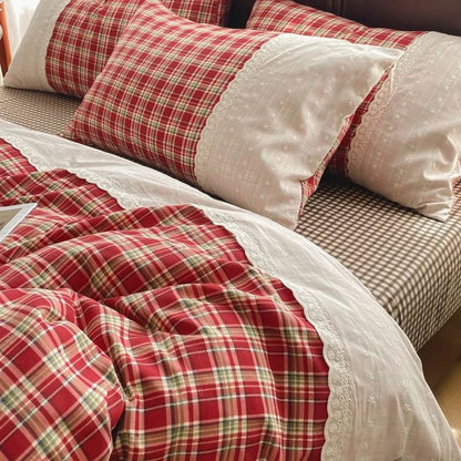Classic Red Check plaid bedding set with white lace trim styled on a bed