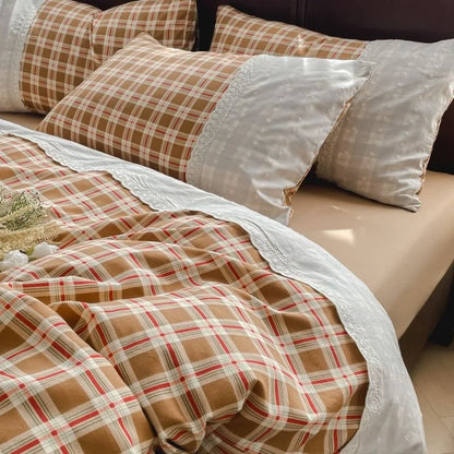 Caramel Check plaid bedding set with white lace trim styled on a bed
