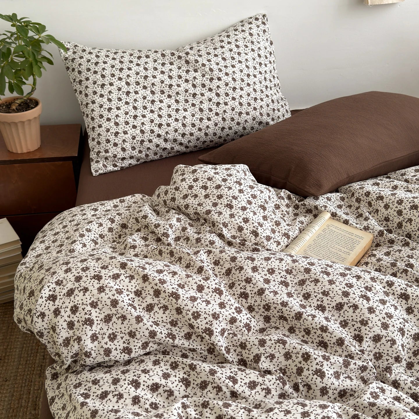 Vanilla Bloom ditsy floral bedding set with solid brown reverse styled on a bed