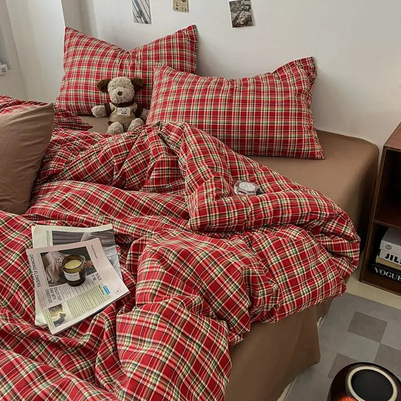 Classic Red Tartan plaid bedding set in red and green check styled on a bed
