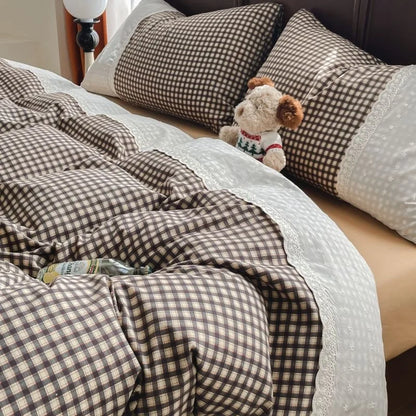 Cocoa Gingham plaid bedding set with white lace trim styled on a bed