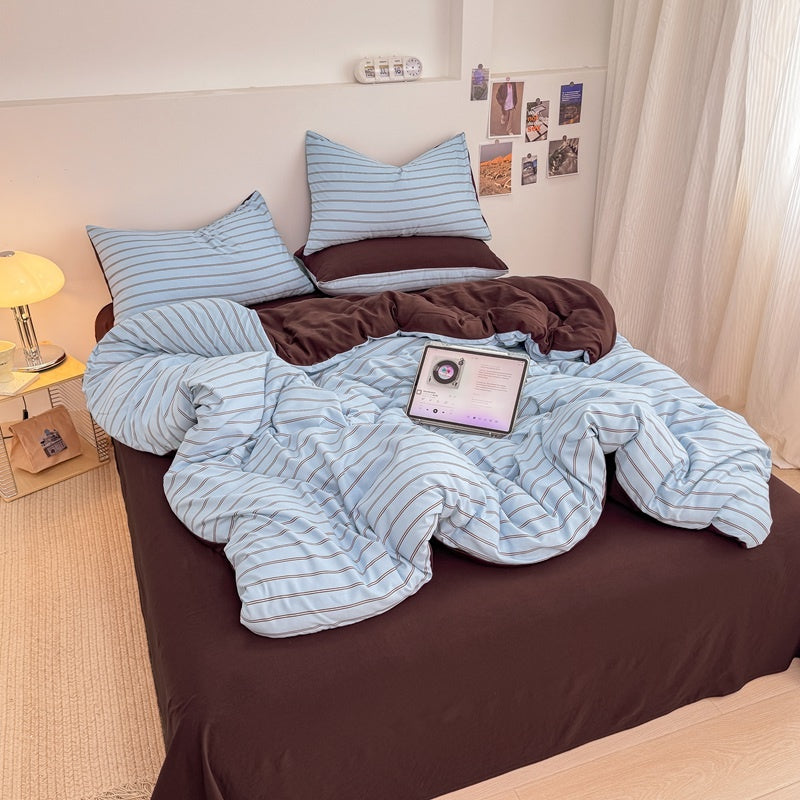 Blue striped bedding set with thin lines on white and a dark brown solid reverse