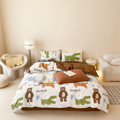 Menagerie Animal Print Cotton Bedding Set - full bed view with brown sheet and printed pillowcases - WhisperLinens
