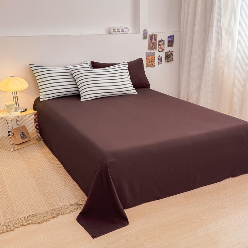 Olive green striped bedding set on white with deep brown solid sheet and reverse