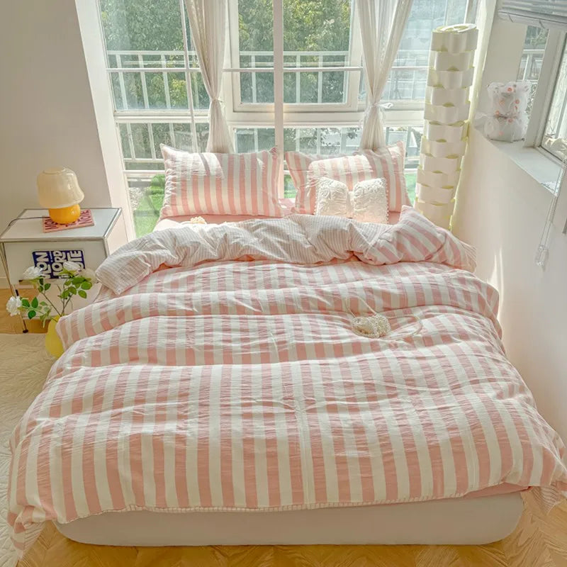 cream bedding set with blush pink and burgundy stripes