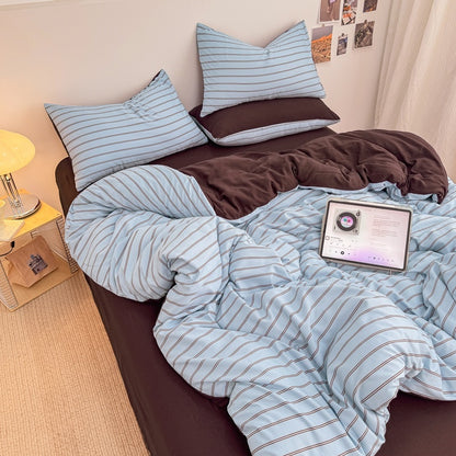 Blue striped bedding set with thin lines on white and a dark brown solid reverse