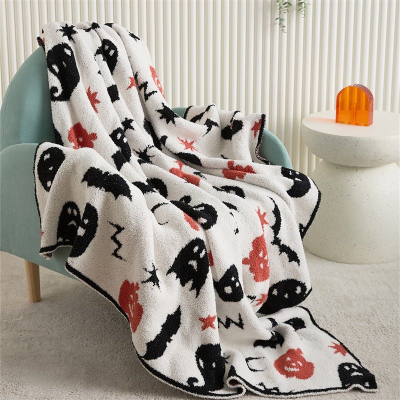 Hollow Halloween Print Fleece Throw Blanket - draped over an armchair - WhisperLinens