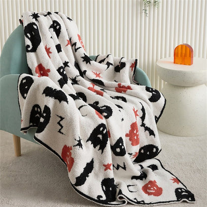 Hollow Halloween Print Fleece Throw Blanket - draped over an armchair - WhisperLinens