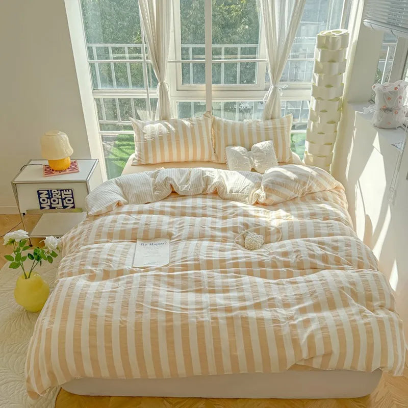 beige bedding set with warm brown and white stripes