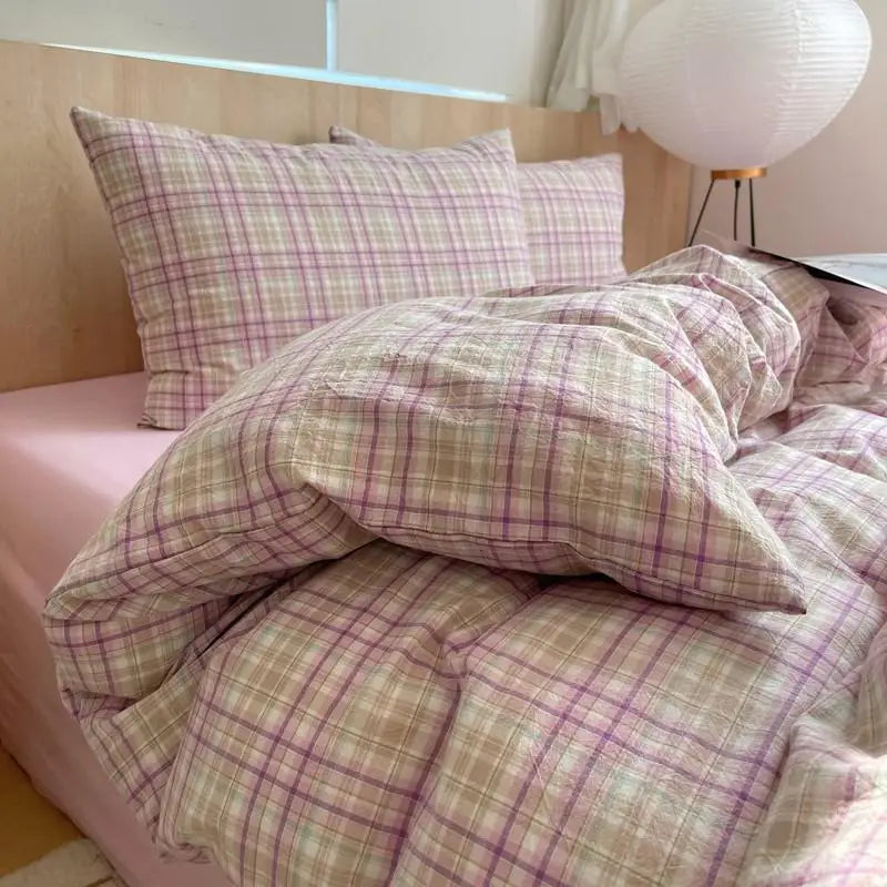 lavender and beige plaid cotton bedding set on bed
