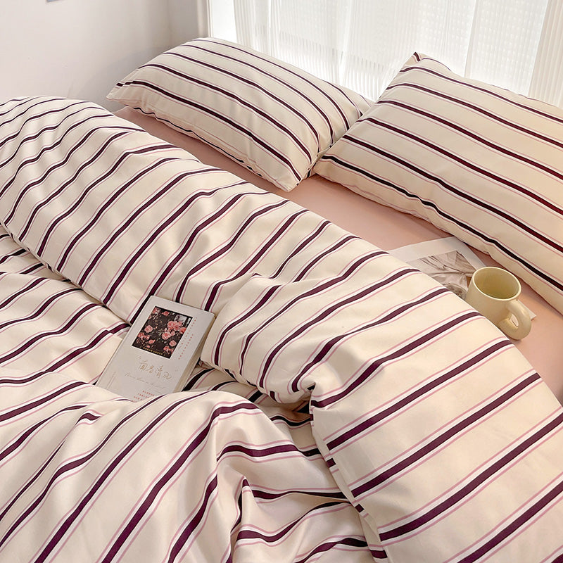 light pink striped bedding set with burgundy and cream detailing