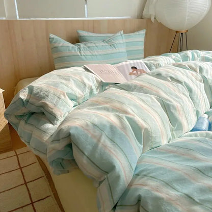 Mint green bedding set with pastel peach and cream stripes in soft breathable fabric