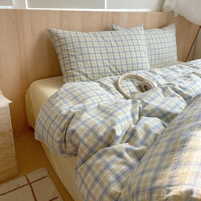 sky blue and sand beige plaid cotton bedding set on bed