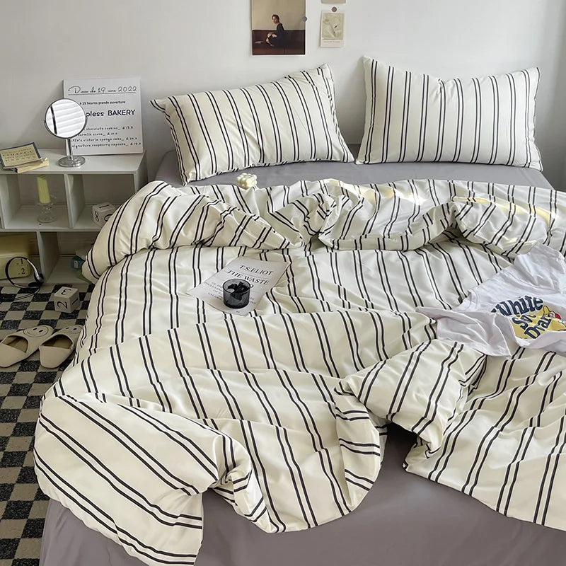 white bedding set with black vertical stripes